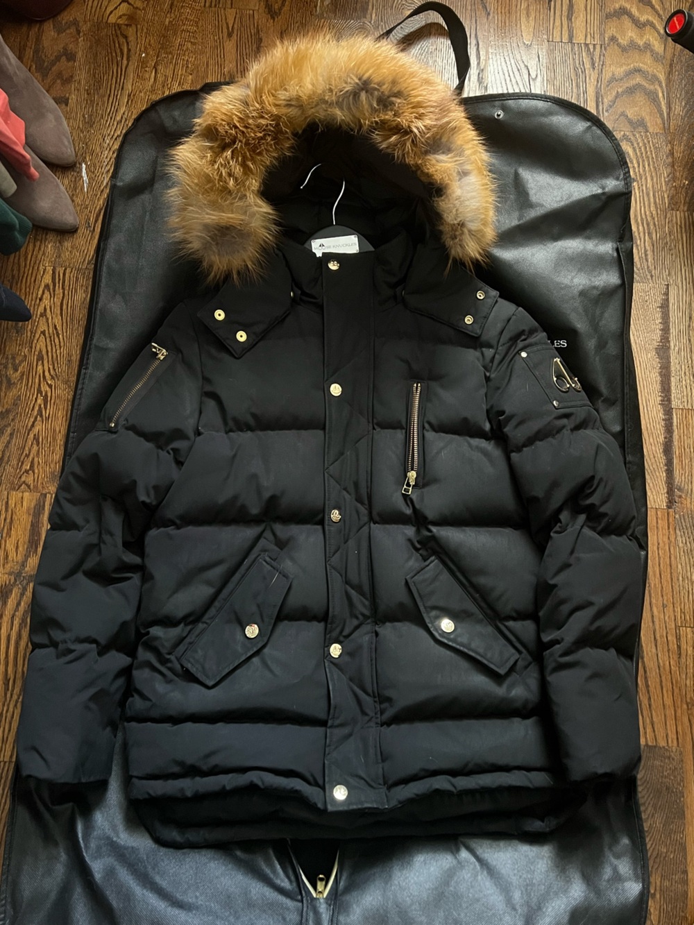 Moose Knuckles Black Winter Jacket with Gold Fur Trim And Accents